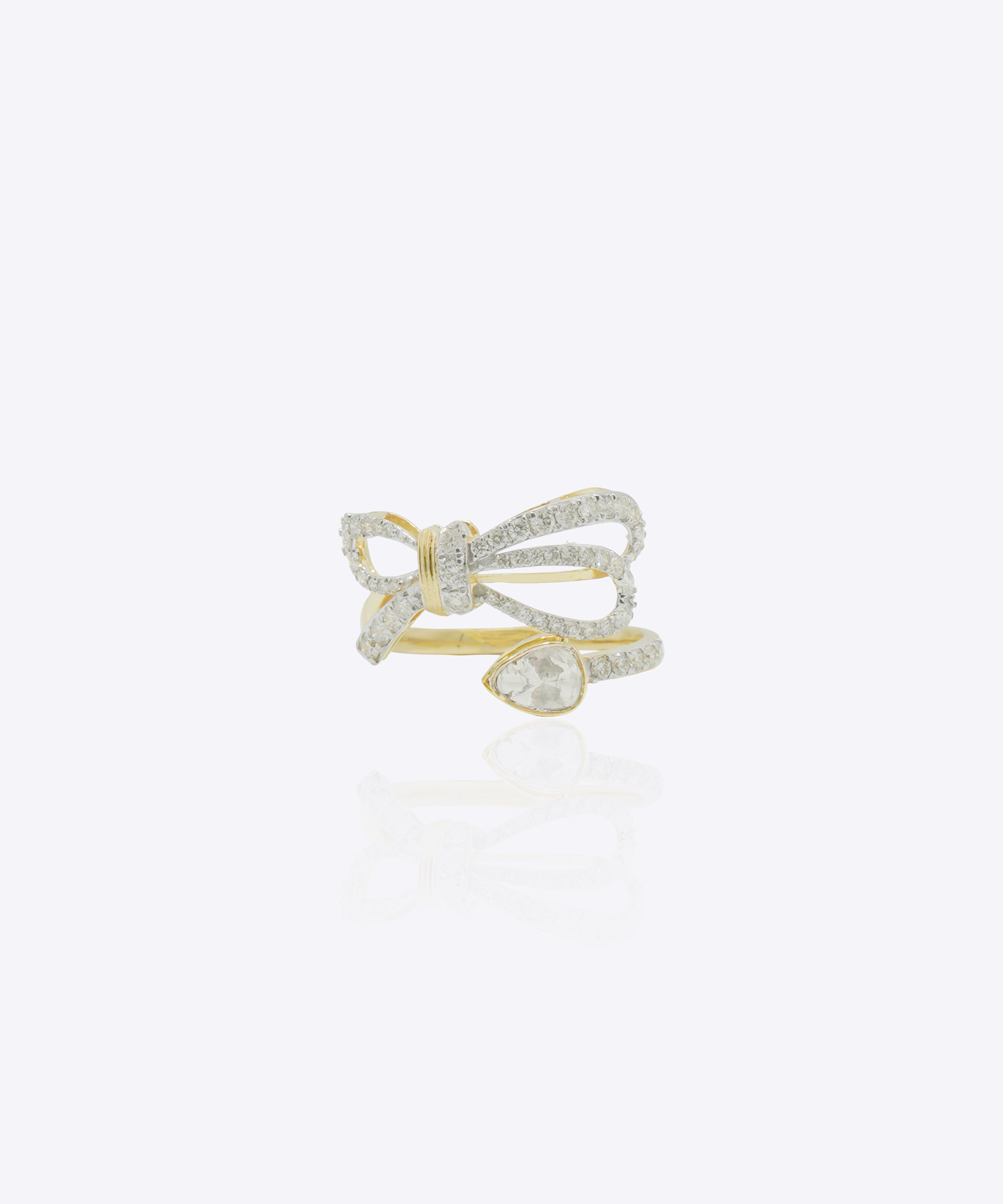 14K gold ring with a sleek ribbon-inspired bow design and refined polished finish.