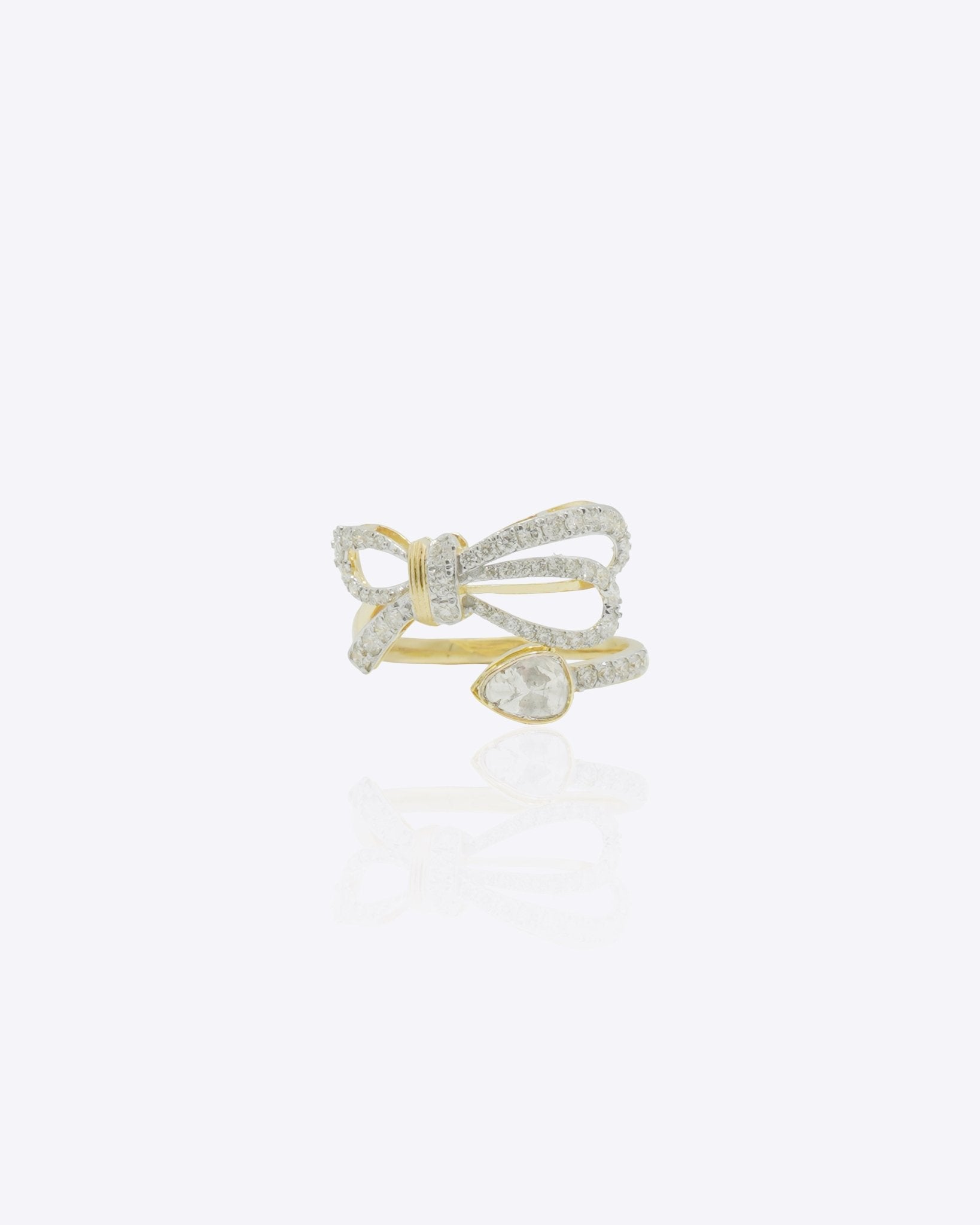 14K gold ring with a sleek ribbon-inspired bow design and refined polished finish.