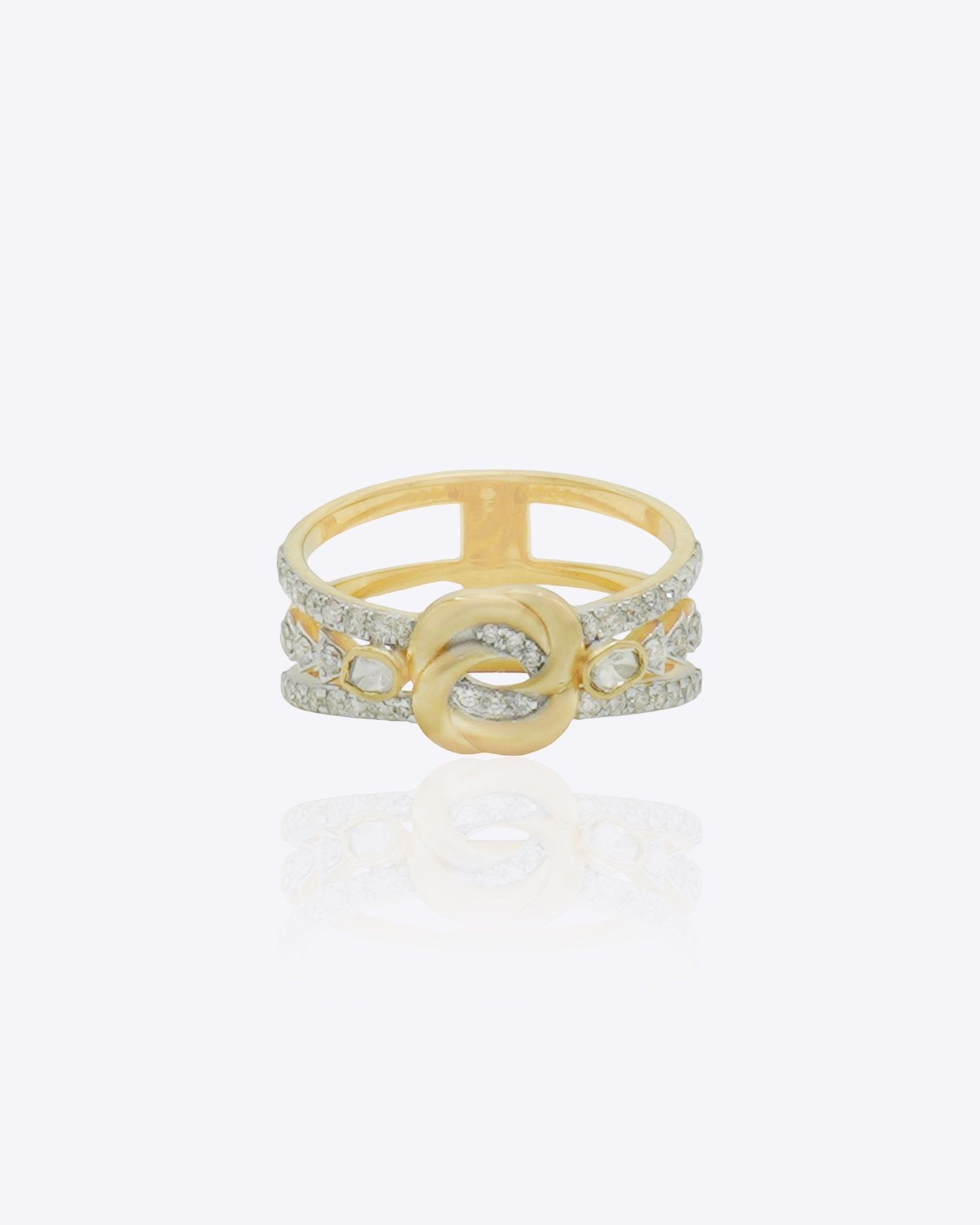 14K gold ring with an interwoven knot design set with Polki diamonds.