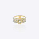 14kt gold ring featuring a sculptural interwoven knot design with a polished, luminous architectural finish.