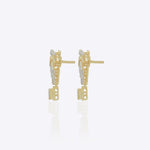 14K gold earrings with a 3D folded bow design and cascading stones.