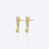 14K gold earrings with a 3D folded bow design and cascading stones.