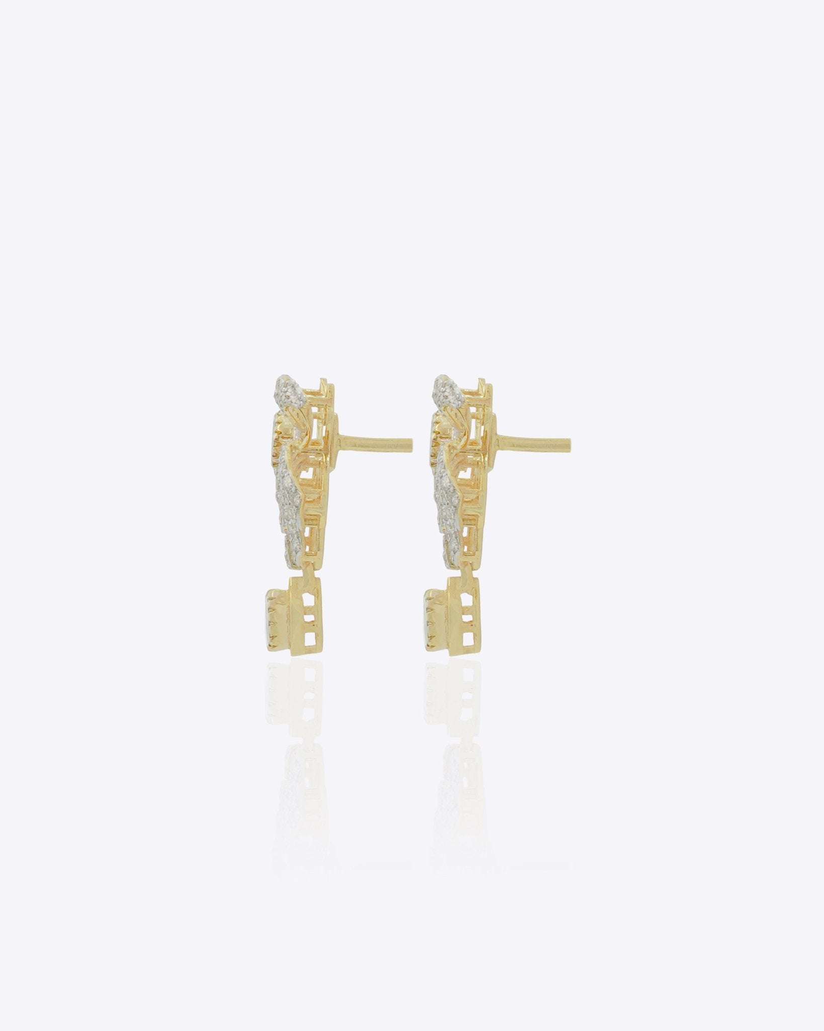 14K gold earrings with a 3D folded bow design and cascading stones.