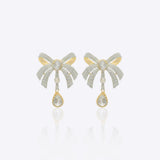 14kt gold earrings featuring a three-dimensional folded bow design with delicate cascading stones for movement.