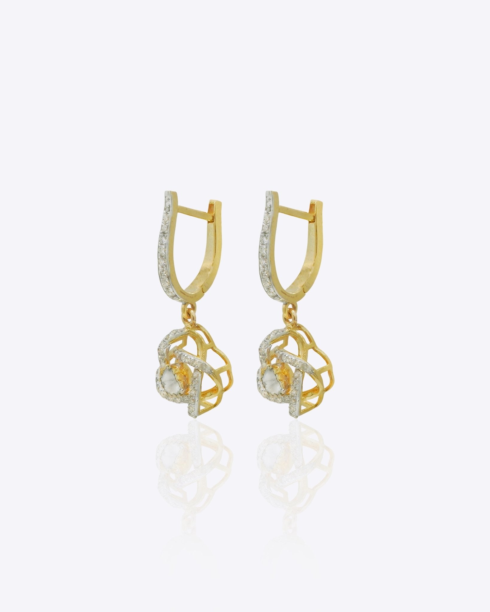 14K gold woven-texture knot earrings with a central luminous stone.