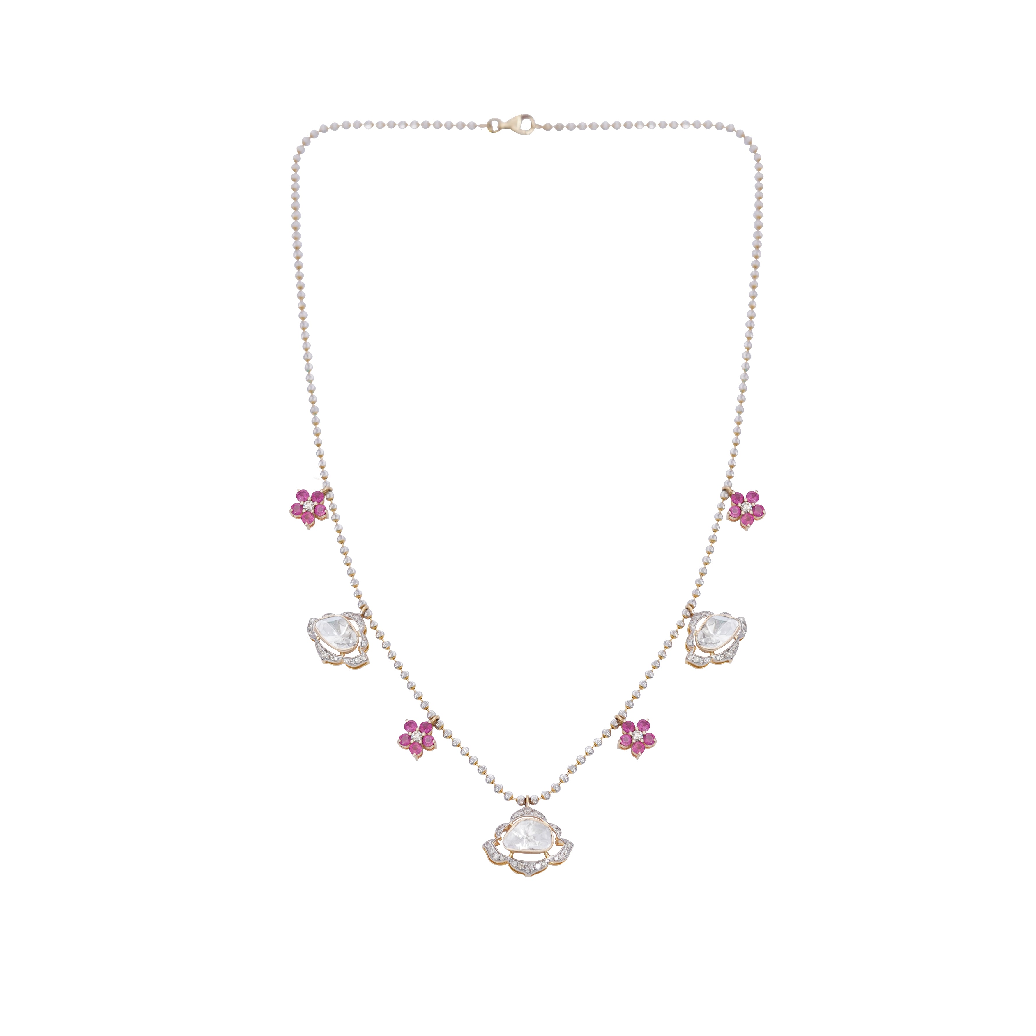 A luxurious Blush Diamond Polki Necklace, combining diamond polkis and floral ruby gemstones with exquisite craftsmanship.