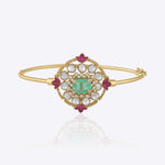Aqua Legacy gold open bangle with geometric Polki motif, aqua gemstone centre and enamel detailing.