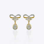 14K gold bow-motif drop earrings with a pear-shaped stone.