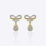 14K gold bow-motif drop earrings with a pear-shaped stone.