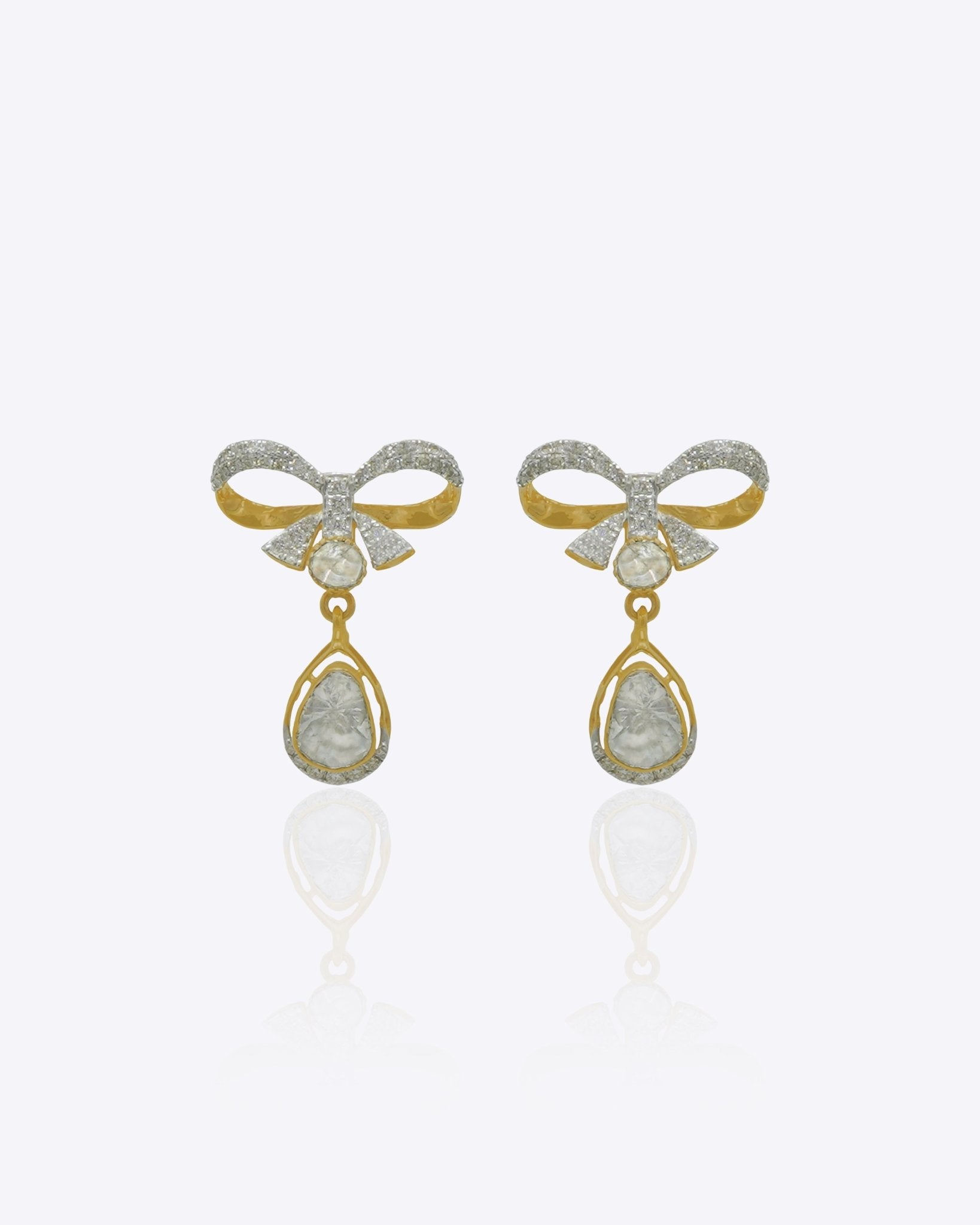 14K gold bow-motif drop earrings with a pear-shaped stone.