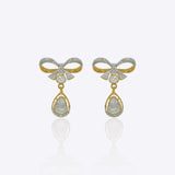 14kt gold earrings featuring a delicate bow motif with small stones and a hanging pear-shaped gemstone droplet.