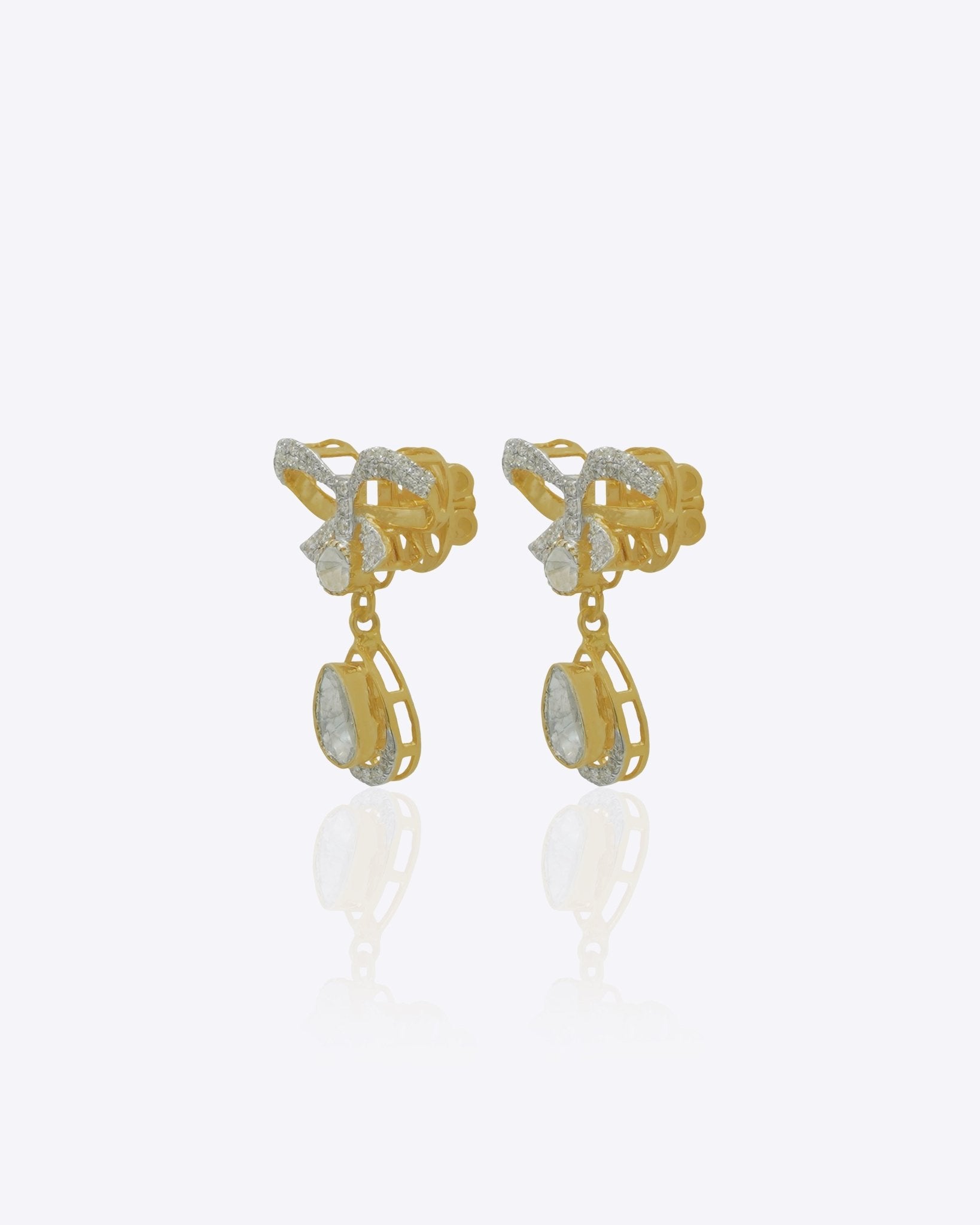 14K gold bow-motif drop earrings with a pear-shaped stone.