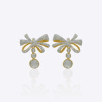 Elegant curved drop earrings with a delicate bow-inspired design and graceful cascading silhouette.