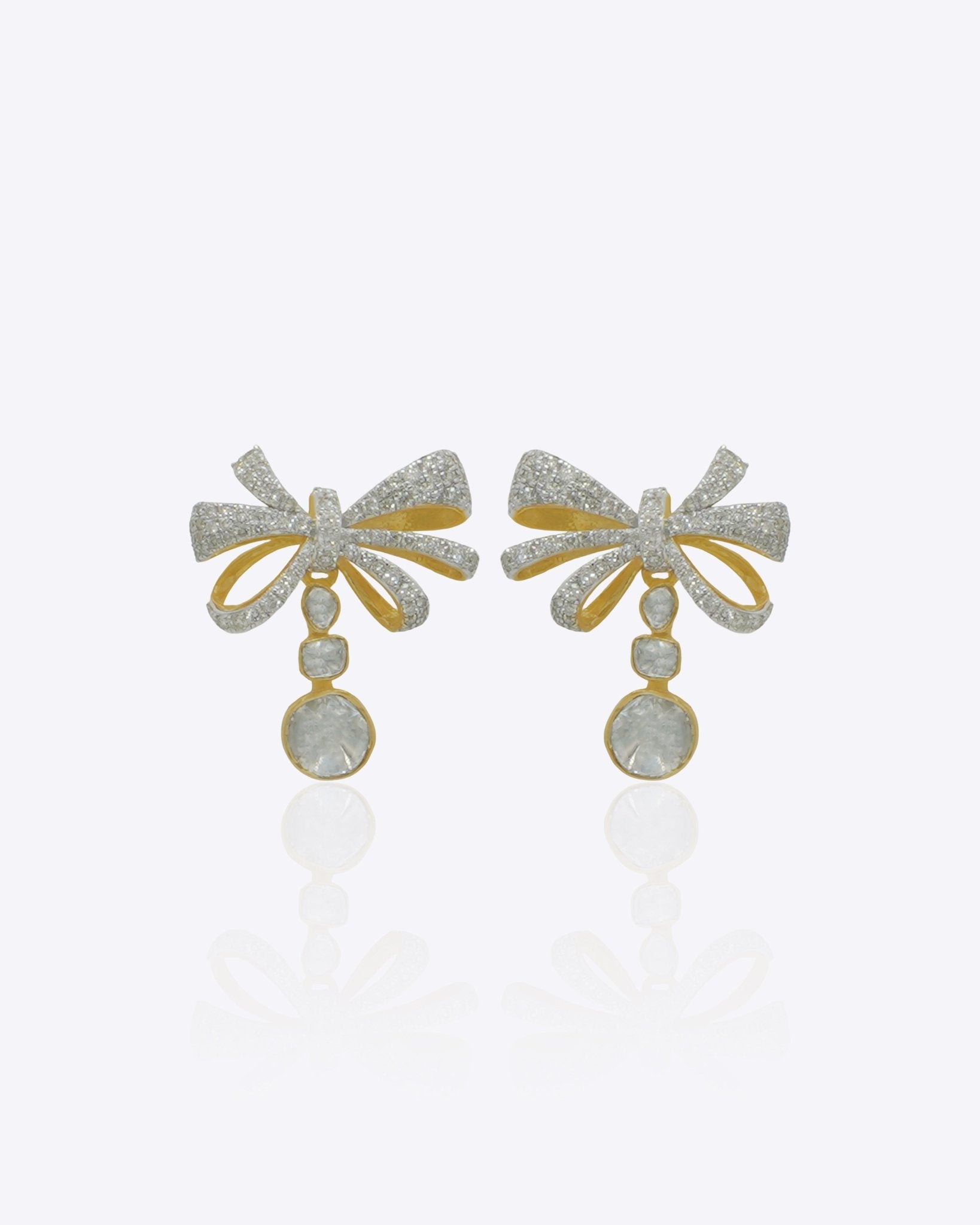 Elegant curved drop earrings with a delicate bow-inspired design and graceful cascading silhouette.