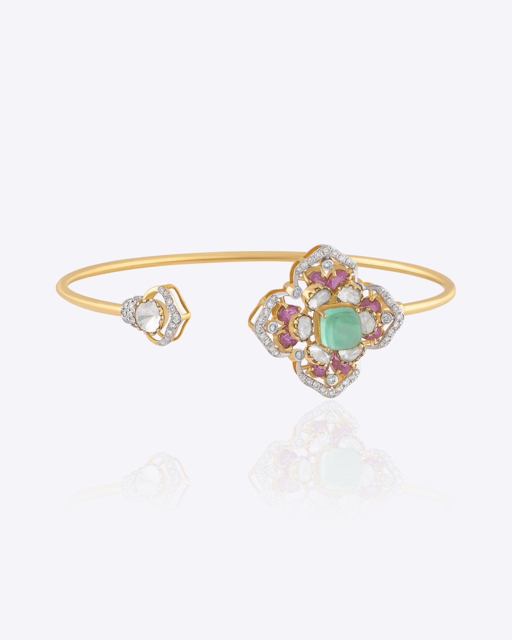 Rose Eclat Bangle in 14K gold with floral Polki motif and emerald-green centre stone