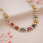 14K gold Navratna Fluttering necklace with vibrant Navratna stones and a Polki border.