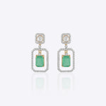 Nyra Drop Earrings with Polki detailing and blue-green gemstones.