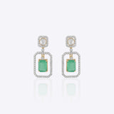 Nyra Drop Earrings with Polki detailing and blue-green gemstones.