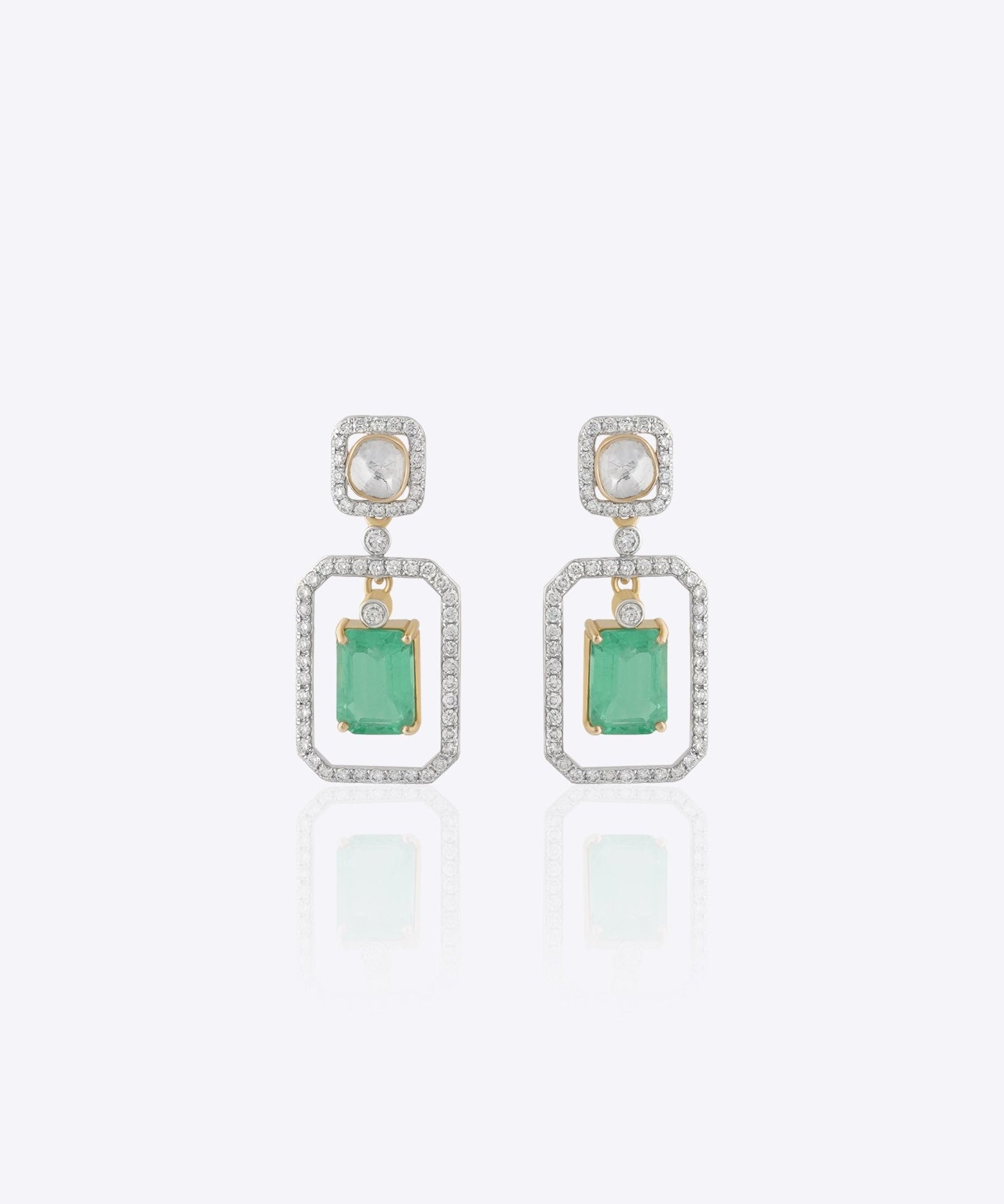 Nyra Drop Earrings with Polki detailing and blue-green gemstones.