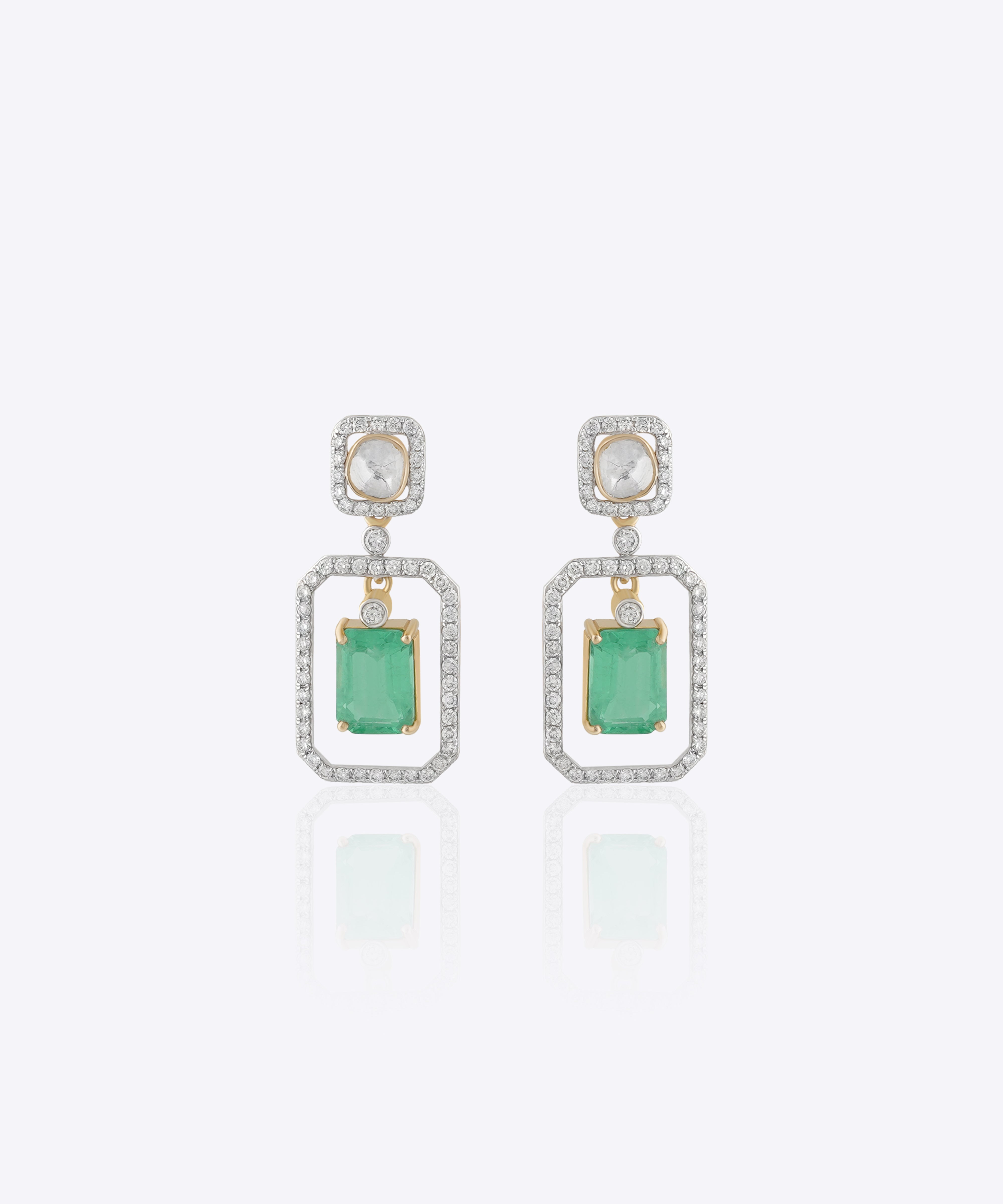 Nyra Drop Earrings with Polki detailing and blue-green gemstones.