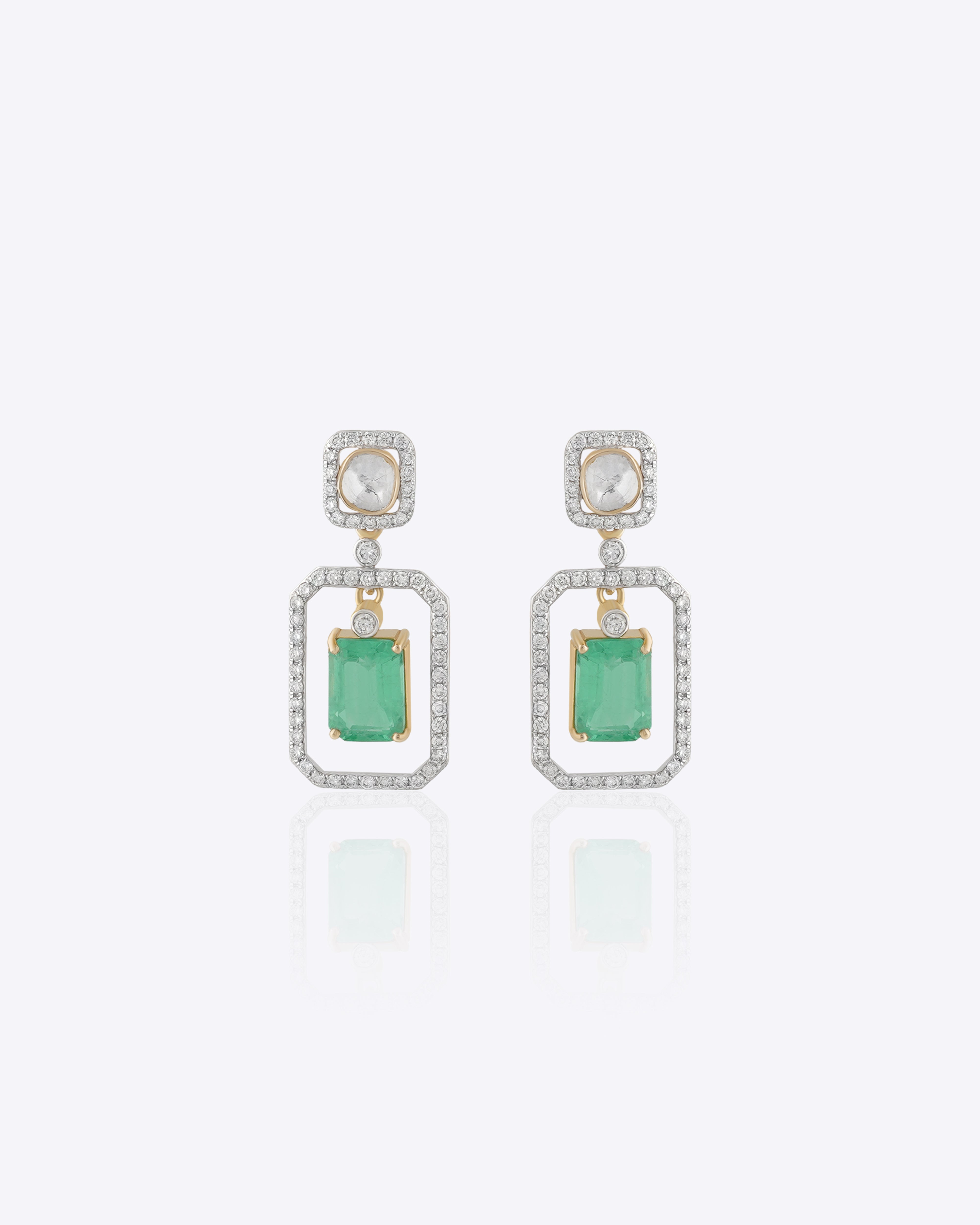 Nyra Drop Earrings with Polki detailing and blue-green gemstones.