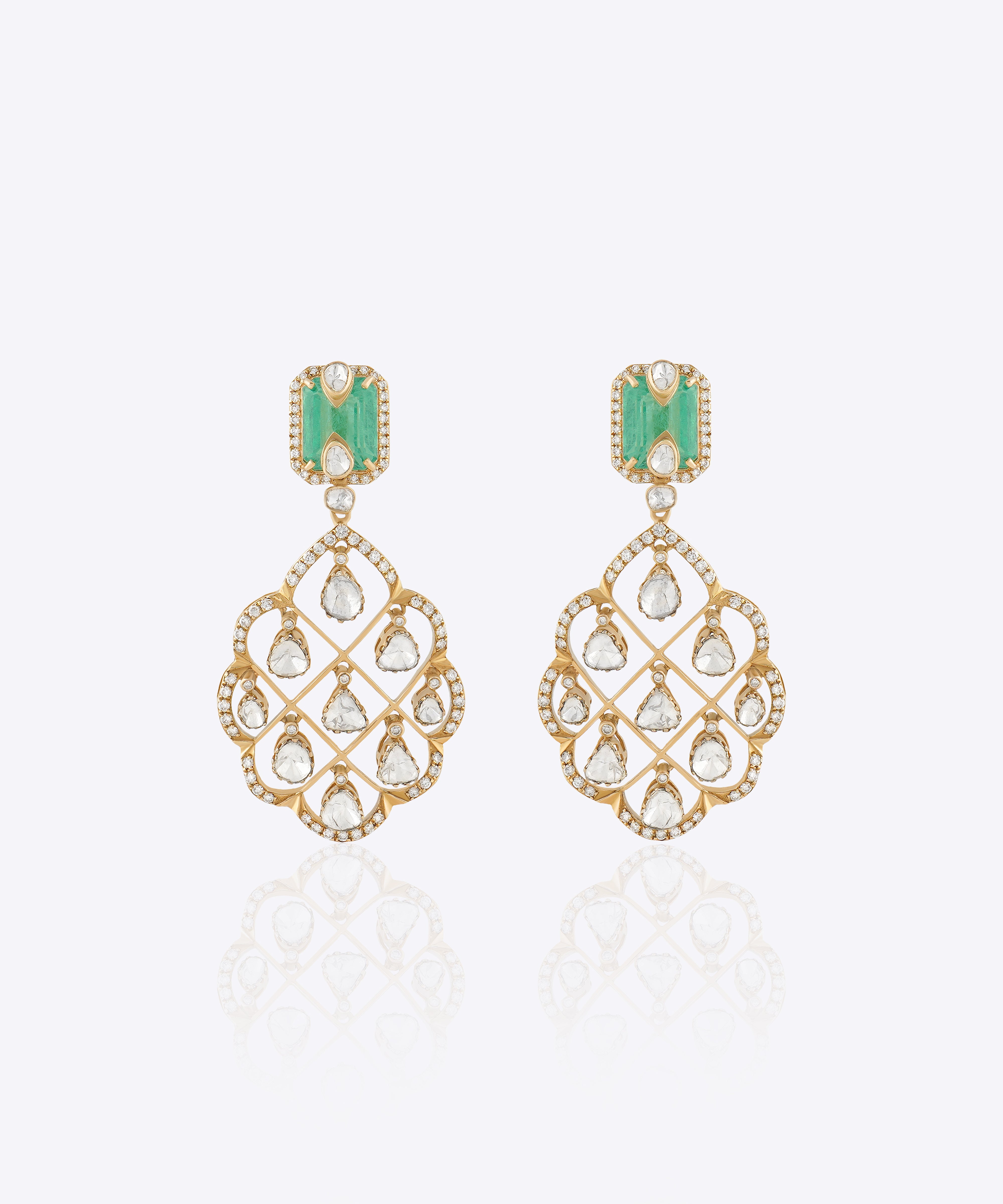 Featuring emerald-cut stones, carved gold filigree, and Polki detailing.