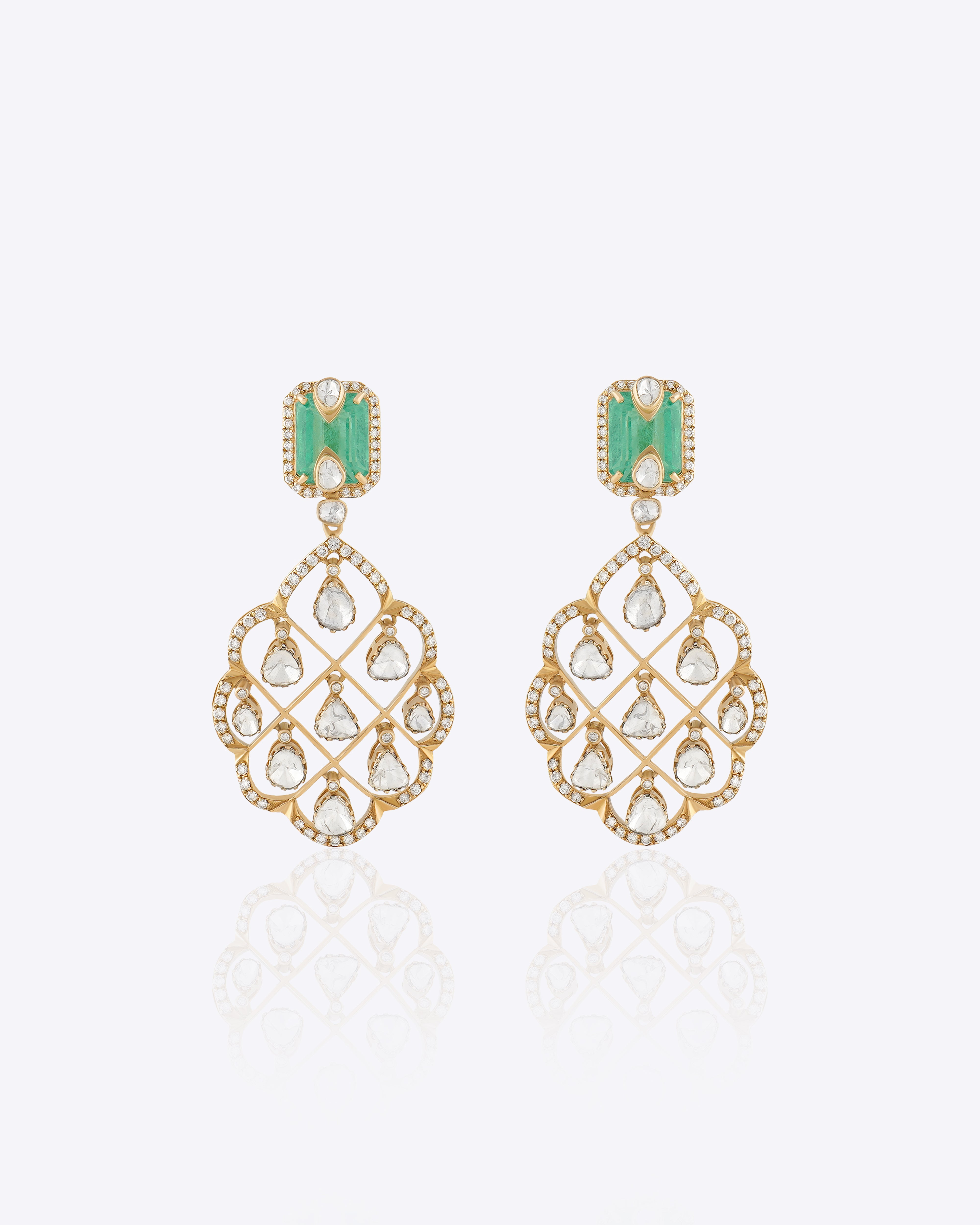Featuring emerald-cut stones, carved gold filigree, and Polki detailing.