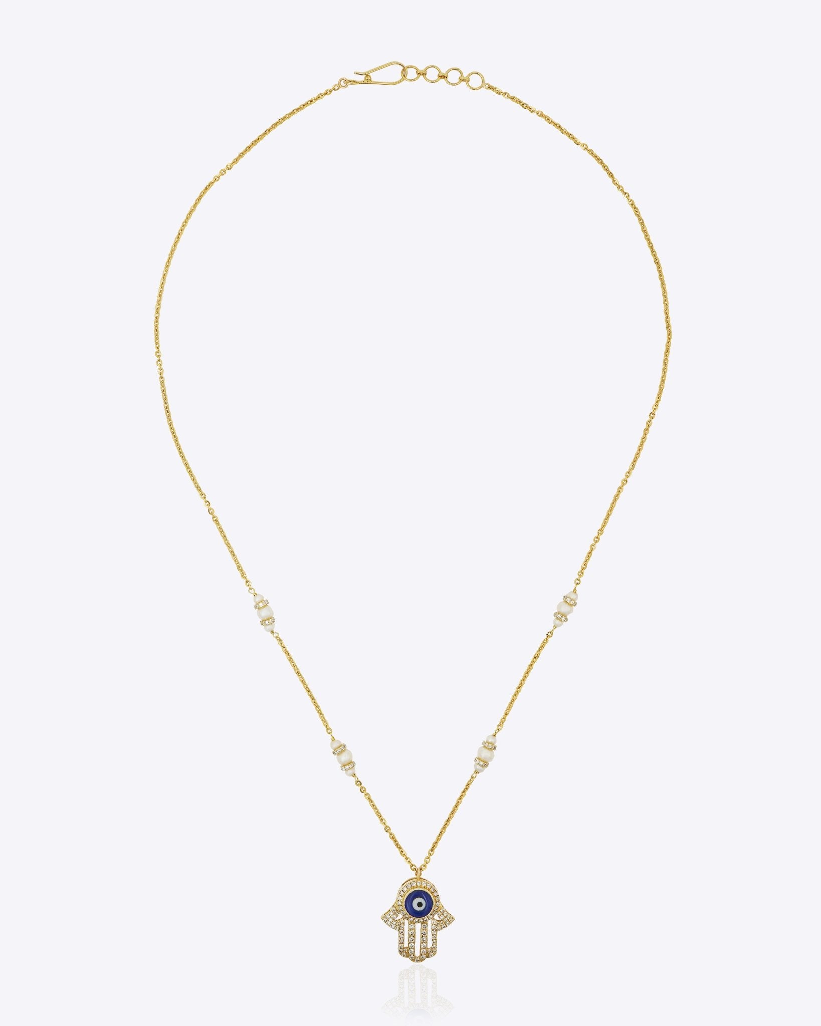 14k gold necklace with an Evil Eye and Hamsa symbol in diamonds