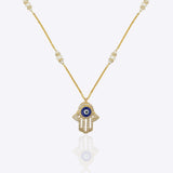 14k gold necklace with an Evil Eye and Hamsa symbol in diamonds