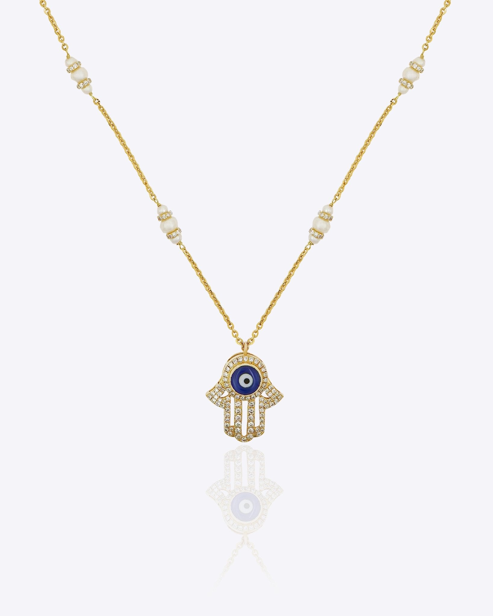 14k gold necklace with an Evil Eye and Hamsa symbol in diamonds