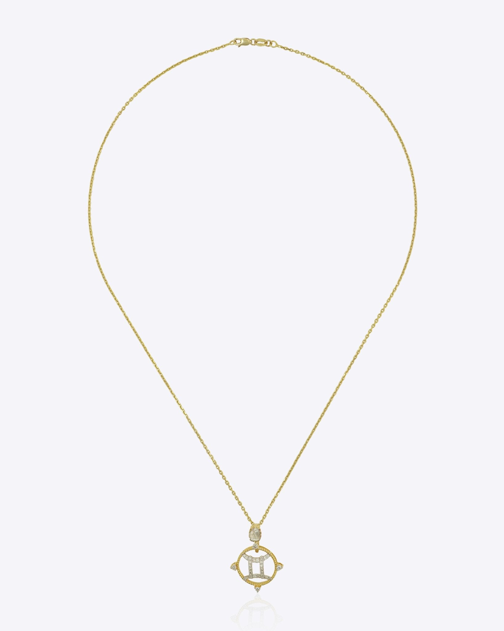 14k gold pendant with Polki and diamonds in a celestial whirl motif
