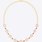 Starlight Rose Necklace in 18K gold with faceted stones and a ruby accent