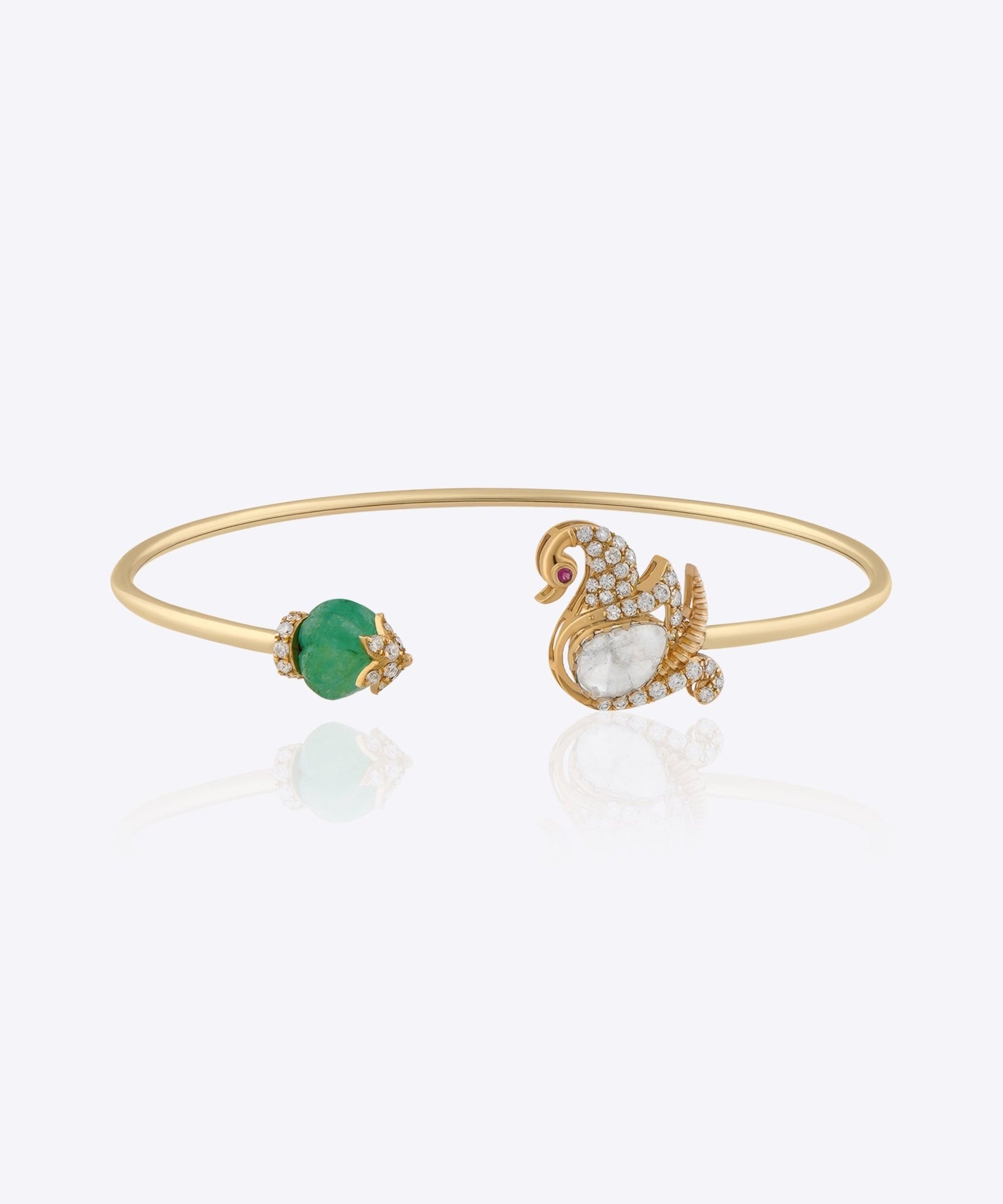 Swan Symphony gold open bangle with Polki swan motif, blue gemstone accent and elegant craftsmanship.