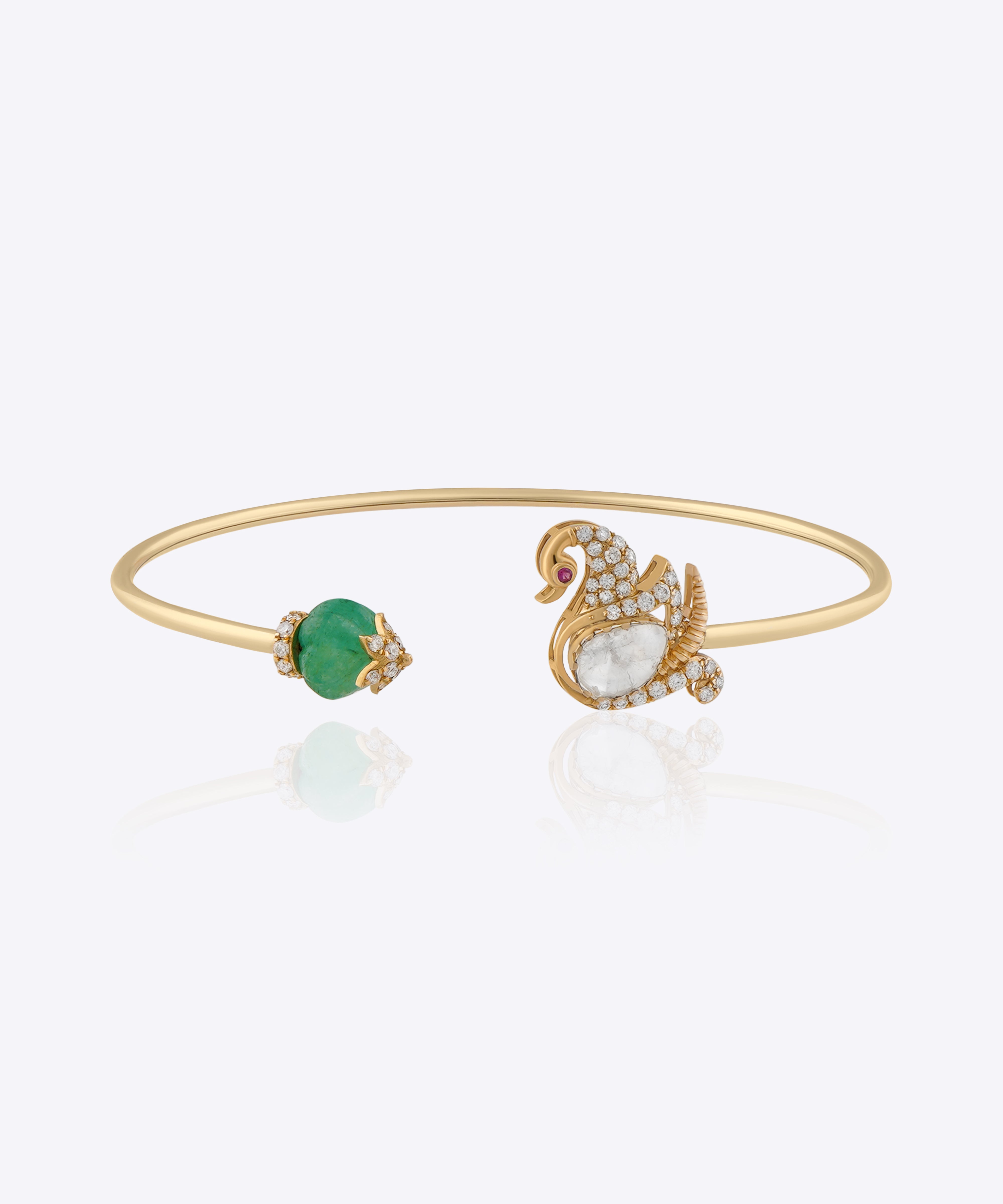Swan Symphony gold open bangle with Polki swan motif, blue gemstone accent and elegant craftsmanship.