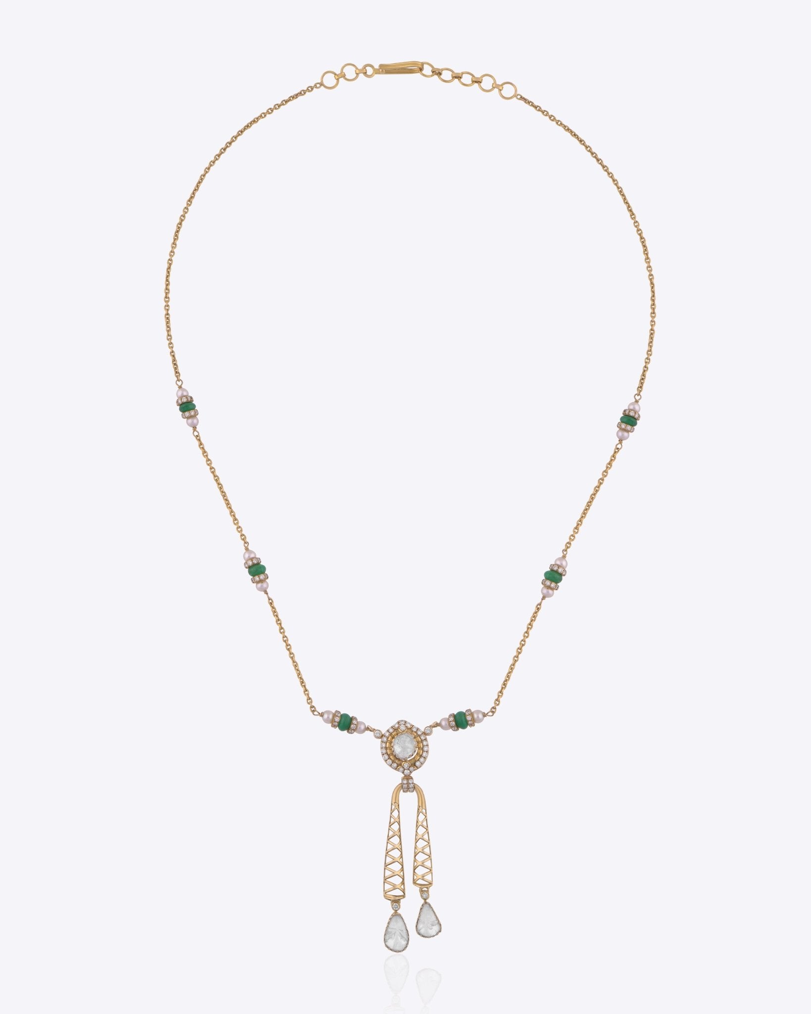 9K gold Opaline Muse necklace with a Polki medallion and emerald-toned accents.