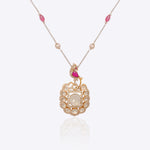 Rose-toned Polki pendant in 14K gold with soft pink stone drop, styled for evening wear.