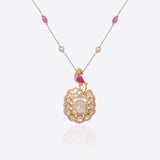 Rose-toned Polki pendant in 14K gold with soft pink stone drop, styled for evening wear.