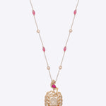 Rose-toned Polki pendant in 14K gold with soft pink stone drop, styled for evening wear.