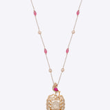 Rose-toned Polki pendant in 14K gold with soft pink stone drop, styled for evening wear.