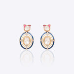 Radiant Polki diamond earrings in 18K gold with talaf stone framing.
