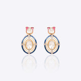 Radiant Polki diamond earrings in 18K gold with talaf stone framing.