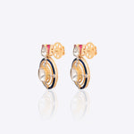 Radiant Polki diamond earrings in 18K gold with talaf stone framing.
