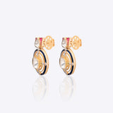 Radiant Polki diamond earrings in 18K gold with talaf stone framing.