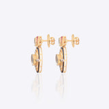 Radiant Polki diamond earrings in 18K gold with talaf stone framing.