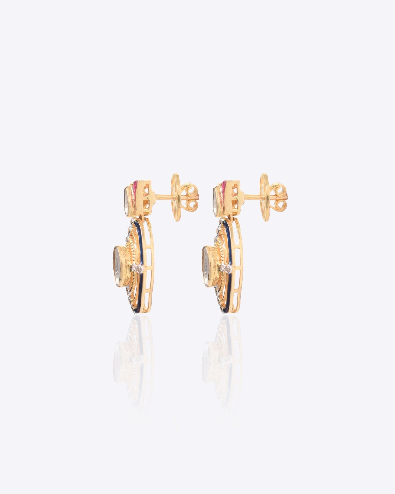 Radiant Polki diamond earrings in 18K gold with talaf stone framing.