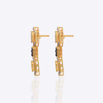 18K gold hexagonal earrings with Polki and vibrant talaf stone accents.