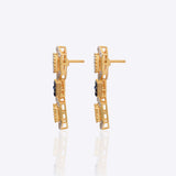 18K gold hexagonal earrings with Polki and vibrant talaf stone accents.
