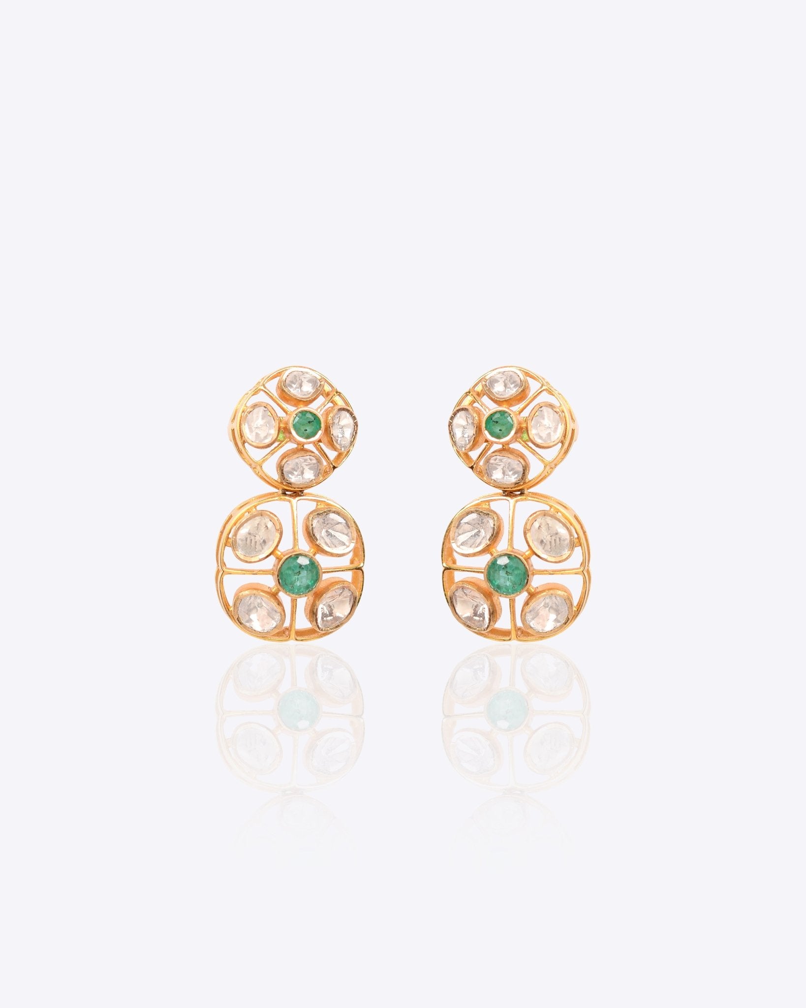 18K gold earrings with a central Polki diamond surrounded by vibrant emeralds.