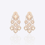 Sundown Flora Earrings in 18K gold with central Polki encircled by diamonds.