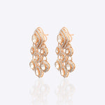 Sundown Flora Earrings in 18K gold with central Polki encircled by diamonds.